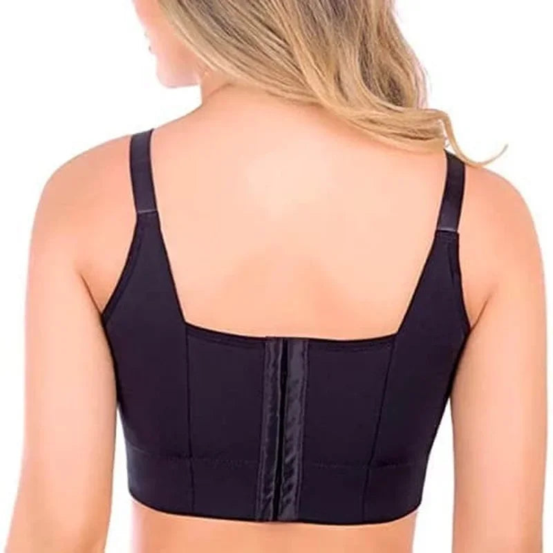 Black sports bra worn by a person on a white background
